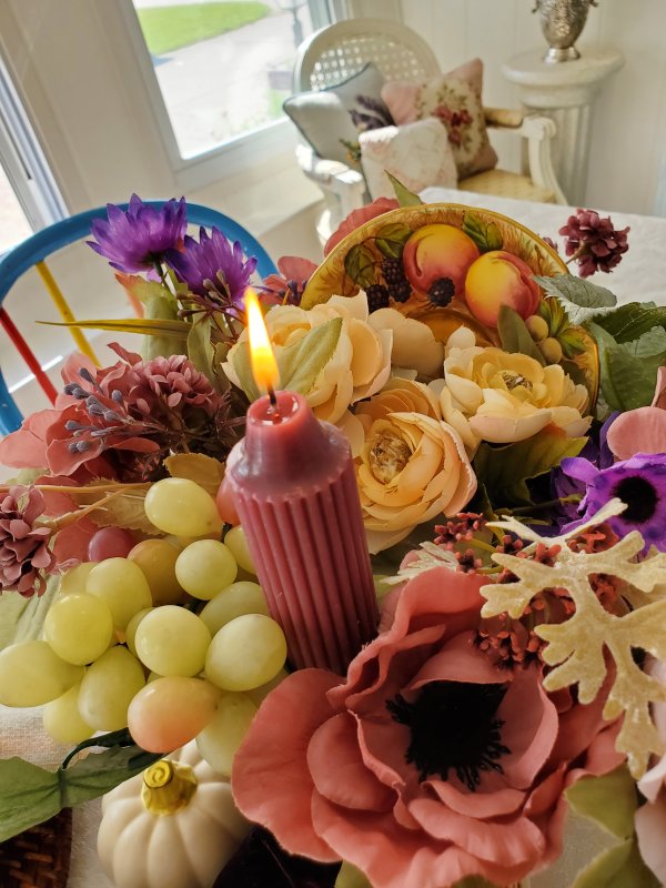 Thanksgiving Fall Centerpiece with silk flowers, china saucer, faux grapes, and candle.