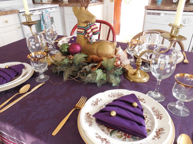 Symmetrical Christmas centerpiece with deer and candles