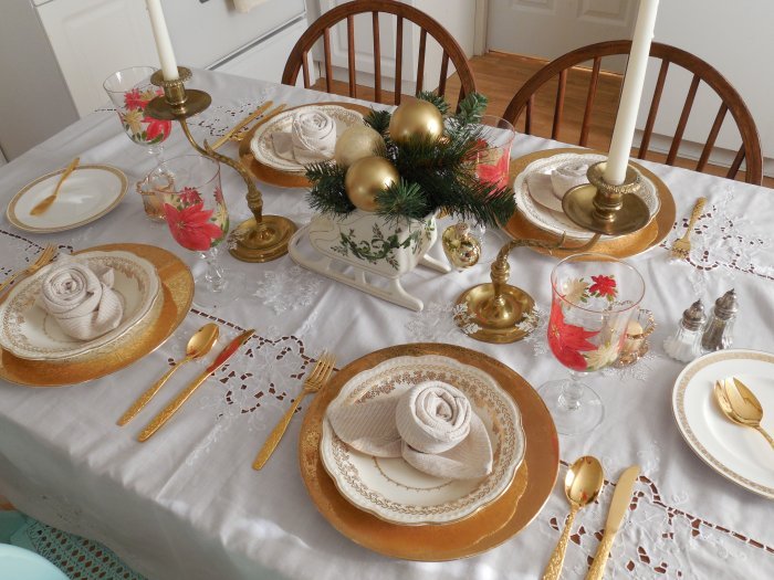 Symmetrical Christmas centerpiece with sleigh and candles