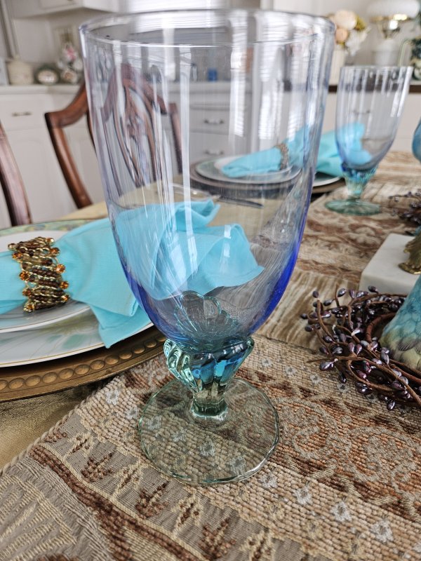 Peacock and gold tablescape