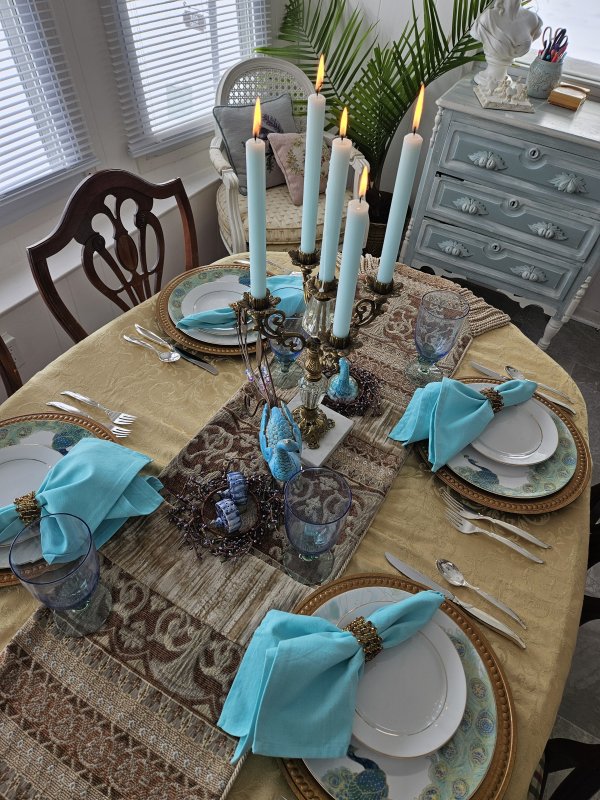 Peacock and gold tablescape