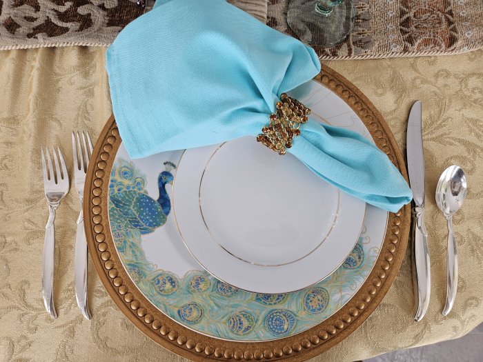 Peacock and gold tablescape