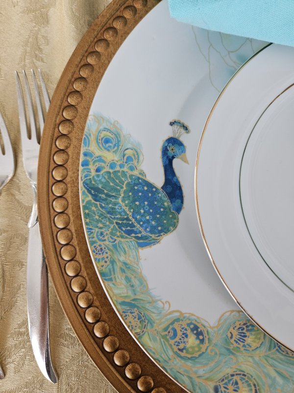 Peacock and gold tablescape